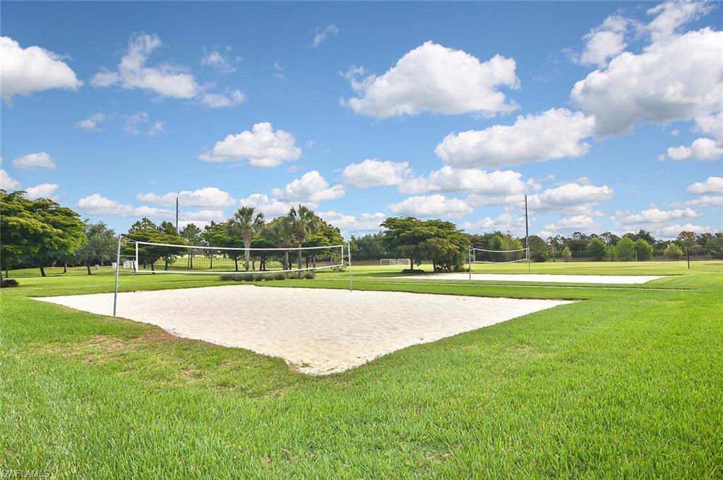 12421 Rock Ridge Lane Fort Myers, FL 33913 - Photo 44 of 50 a view of a golf course with a lake