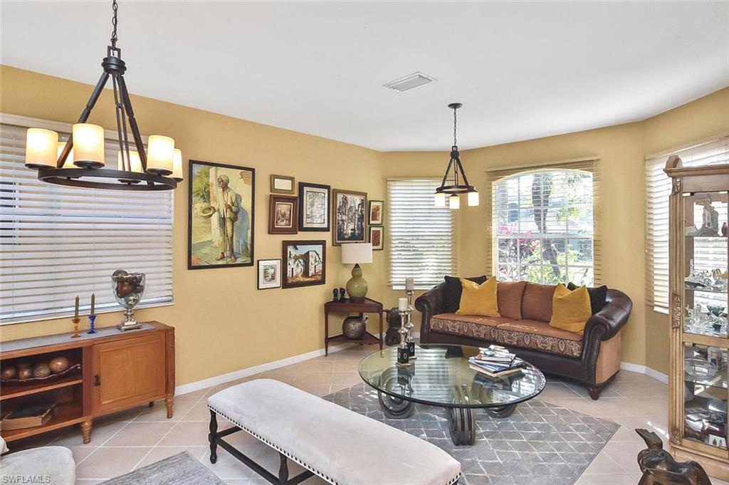 12421 Rock Ridge Lane Fort Myers, FL 33913 - Photo 5 of 50 a living room with furniture a window and a chandelier