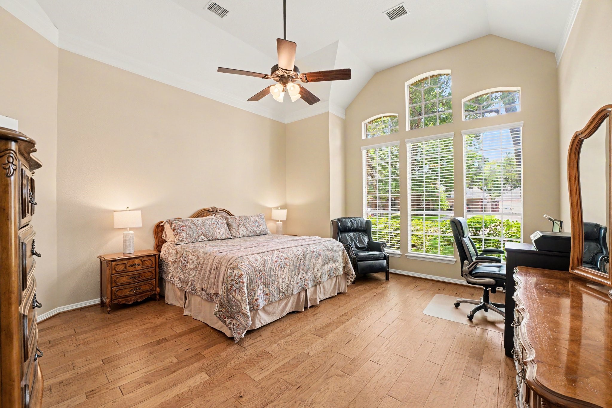 3411 Fir Forest Drive Spring, TX 77388 - Photo 16 of 39 The primary bedroom features floor-to-ceiling windows and tall ceilings.