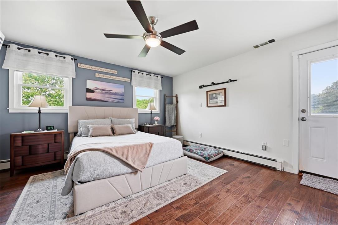 7722 Sechler Road New Tripoli, PA 18066 - Photo 24 of 58 Rich hardwood flooring and abundant natural light define this welcoming bedroom retreat.
