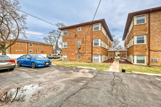 a view of a cars parked in front of a house