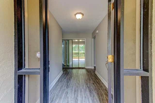 a kitchen with stainless steel appliances granite countertop a sink a stove and cabinets
