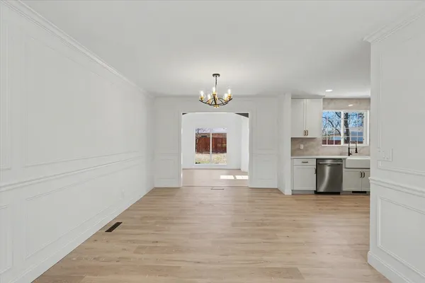 a view of a kitchen with stove and cabinets