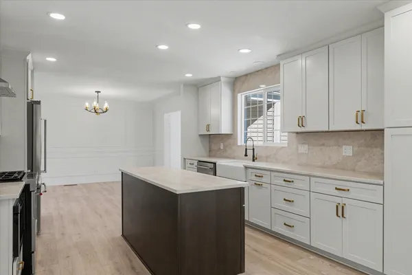 a kitchen with sink cabinets and window
