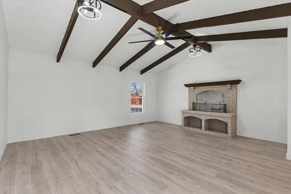 a view of a hardwood floor in a room