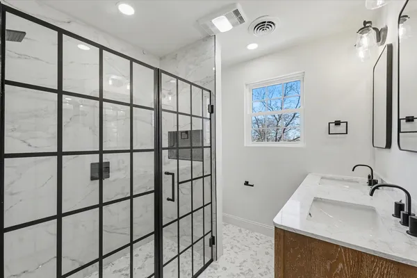 a bathroom with a sink and mirror