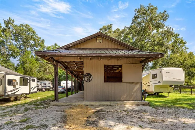 a bathroom with a sink and a shower curtain
