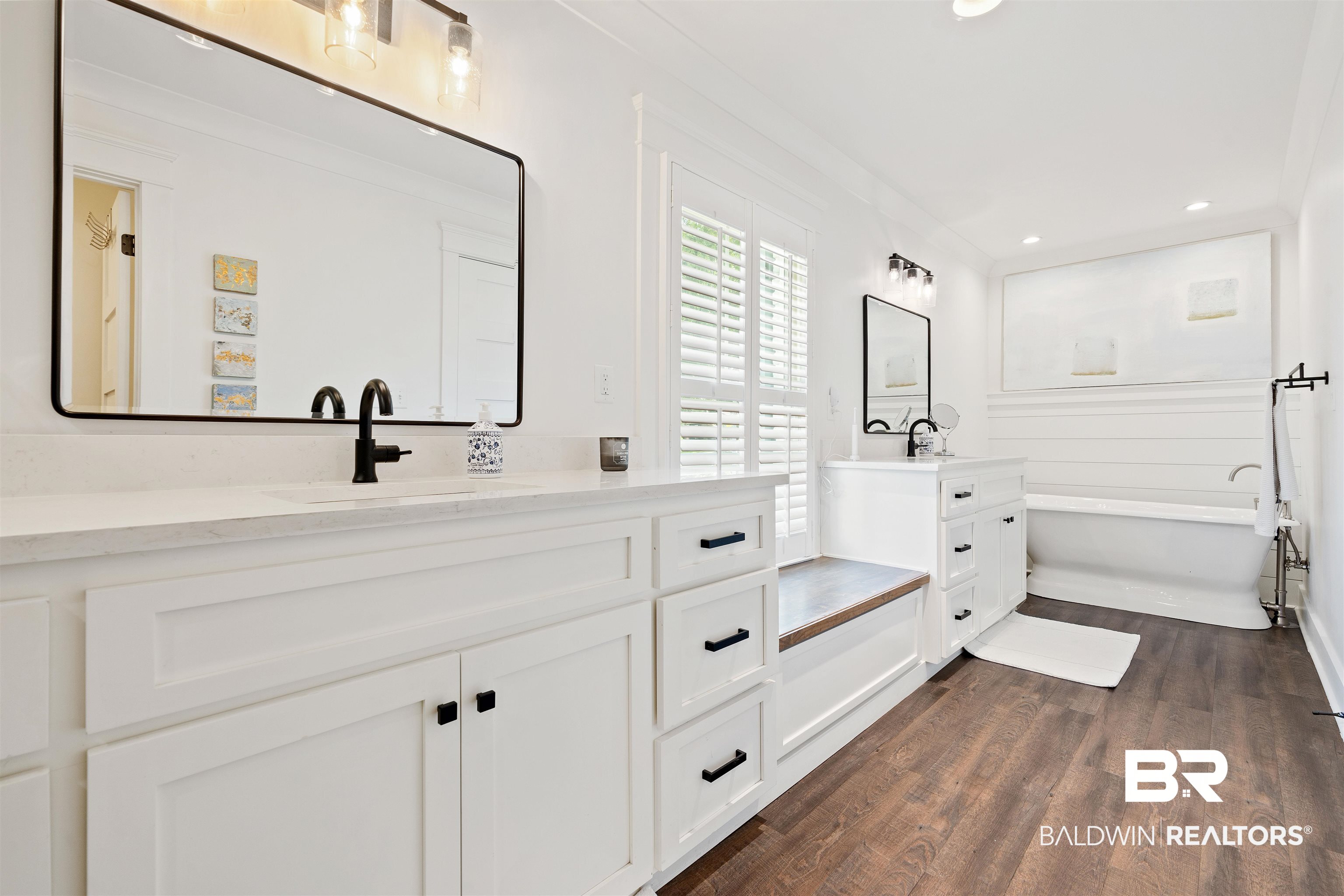 3808 Claridge Road North Mobile, AL 36608 - Photo 20 of 43 Bathroom featuring hardwood / wood-style floors, vanity, and a bathtub