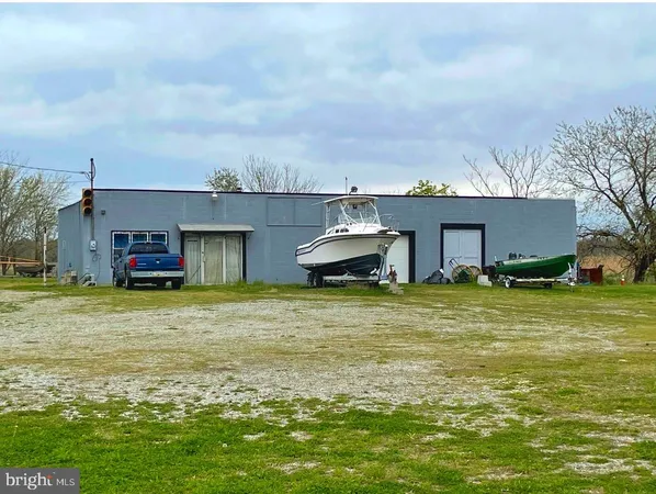 a bathroom with a tub and view of a big yard