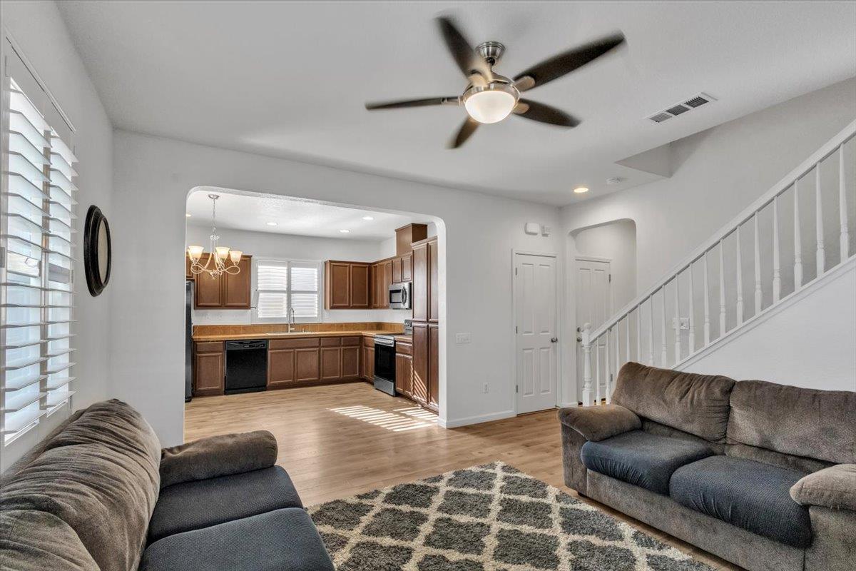 2608 Greenleaf Street Manteca, CA 95337 - Photo 16 of 65 a living room with furniture and kitchen view