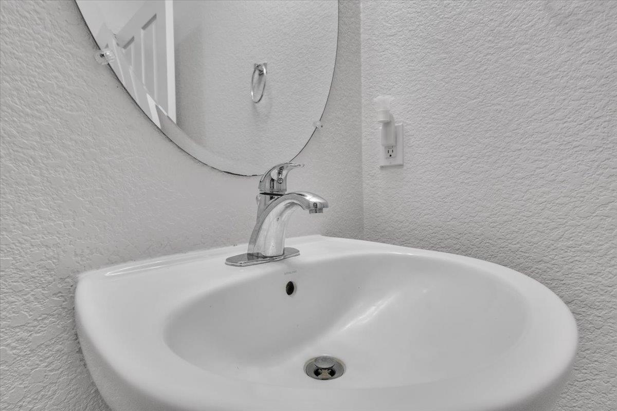 2608 Greenleaf Street Manteca, CA 95337 - Photo 20 of 65 a white bath tub sitting in a bathroom