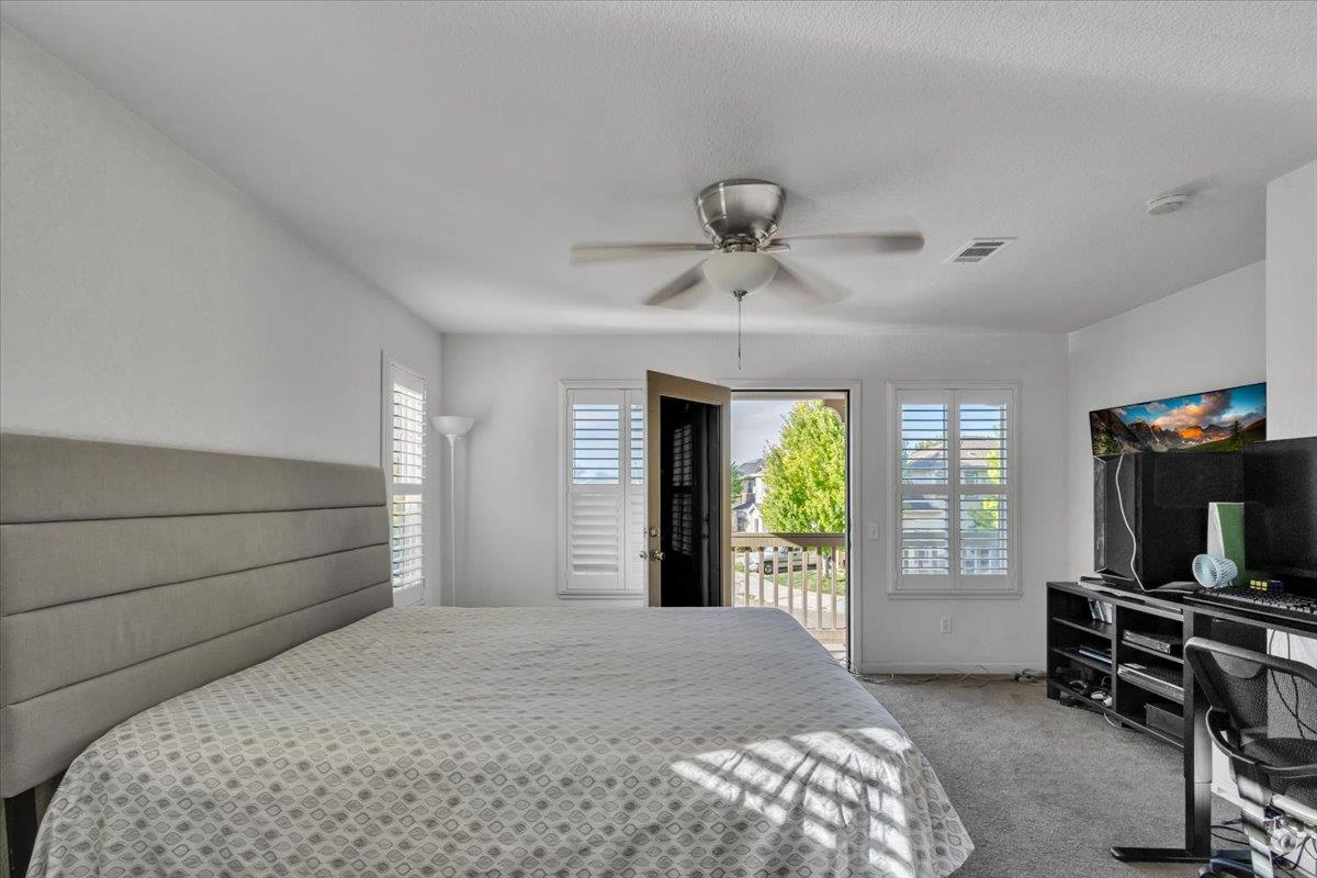 2608 Greenleaf Street Manteca, CA 95337 - Photo 26 of 65 a bedroom with a bed and a television