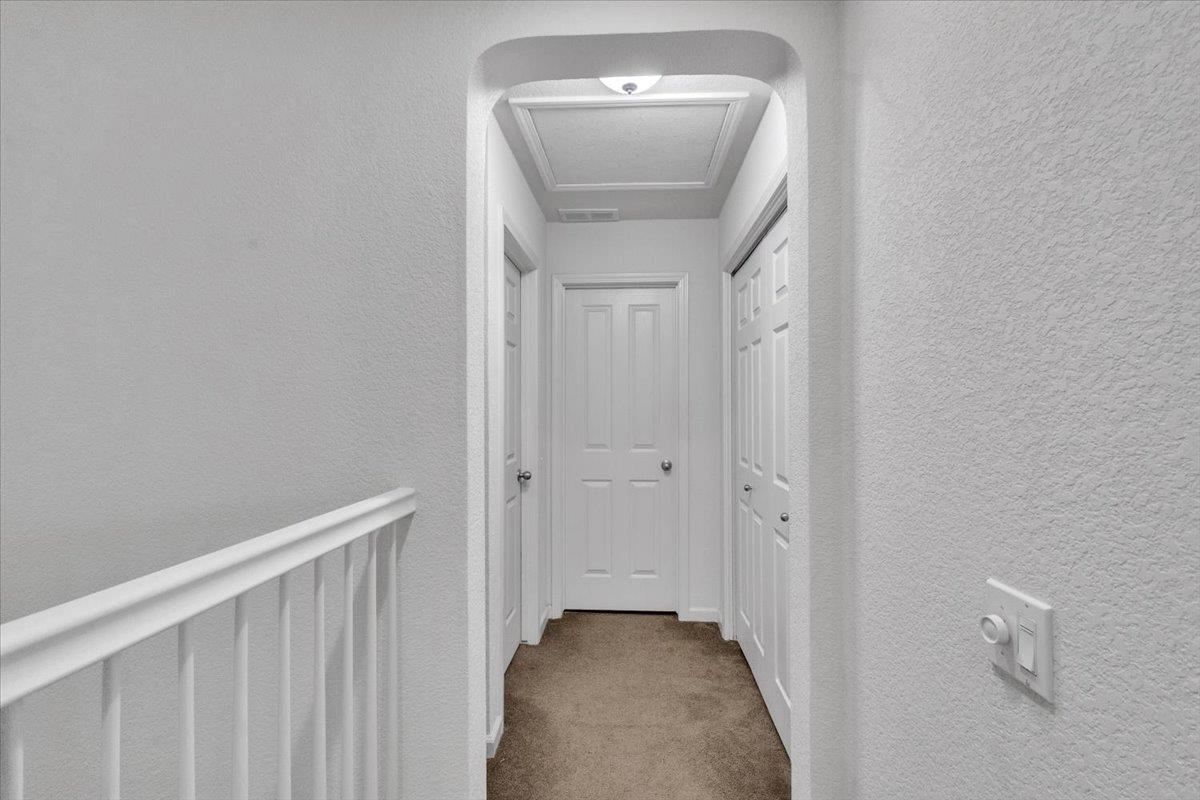 2608 Greenleaf Street Manteca, CA 95337 - Photo 42 of 65 a view of a hallway with a mirror