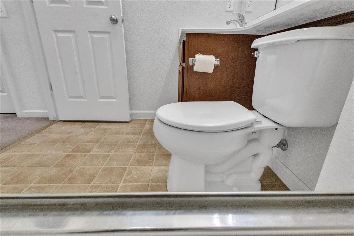 2608 Greenleaf Street Manteca, CA 95337 - Photo 49 of 65 a bathroom with a toilet and a shower
