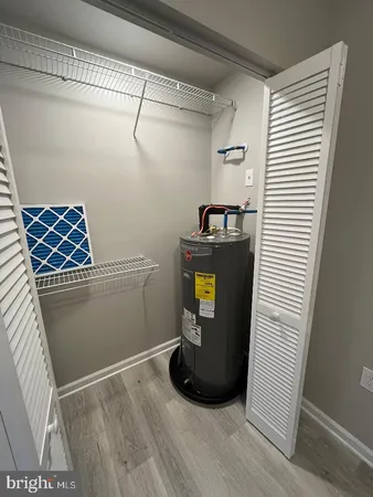 a view of storage and utility room with washer and dryer
