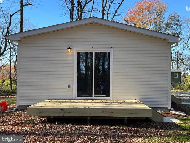 a view of house with swimming pool
