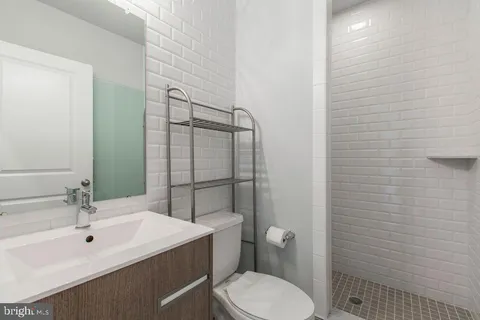 a front view of a house with a garden and patio