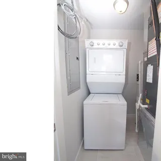 a view of an apartment with a backyard