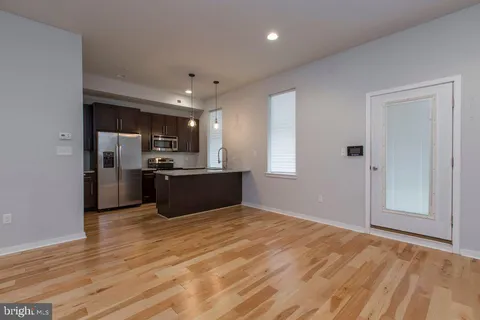 a view of kitchen with wooden floor