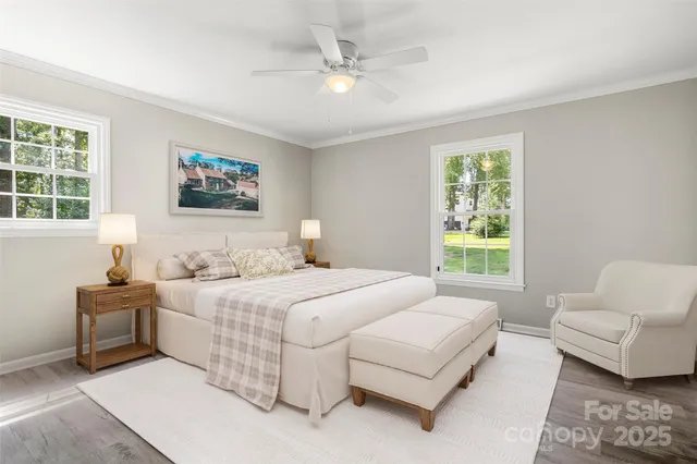 a bedroom with a bed couch and a window