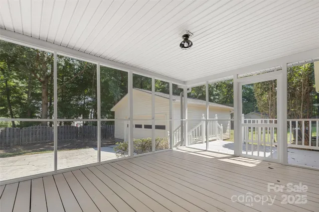 a view of backyard with porch and wooden floor