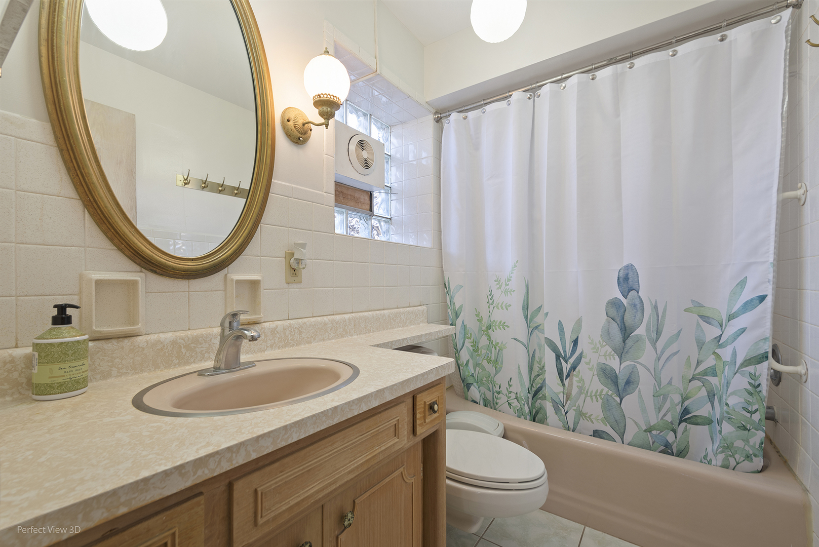1121 North Northwest Highway Park Ridge, IL 60068 - Photo 12 of 26 a bathroom with a sink a toilet and a mirror