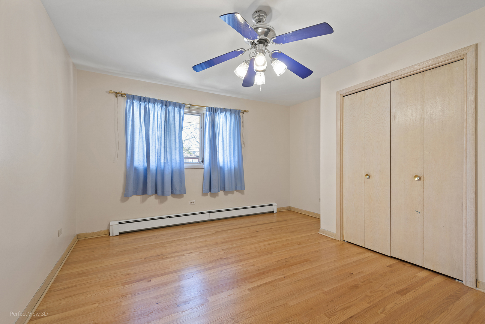 1121 North Northwest Highway Park Ridge, IL 60068 - Photo 13 of 26 an empty room with wooden floor fan and windows