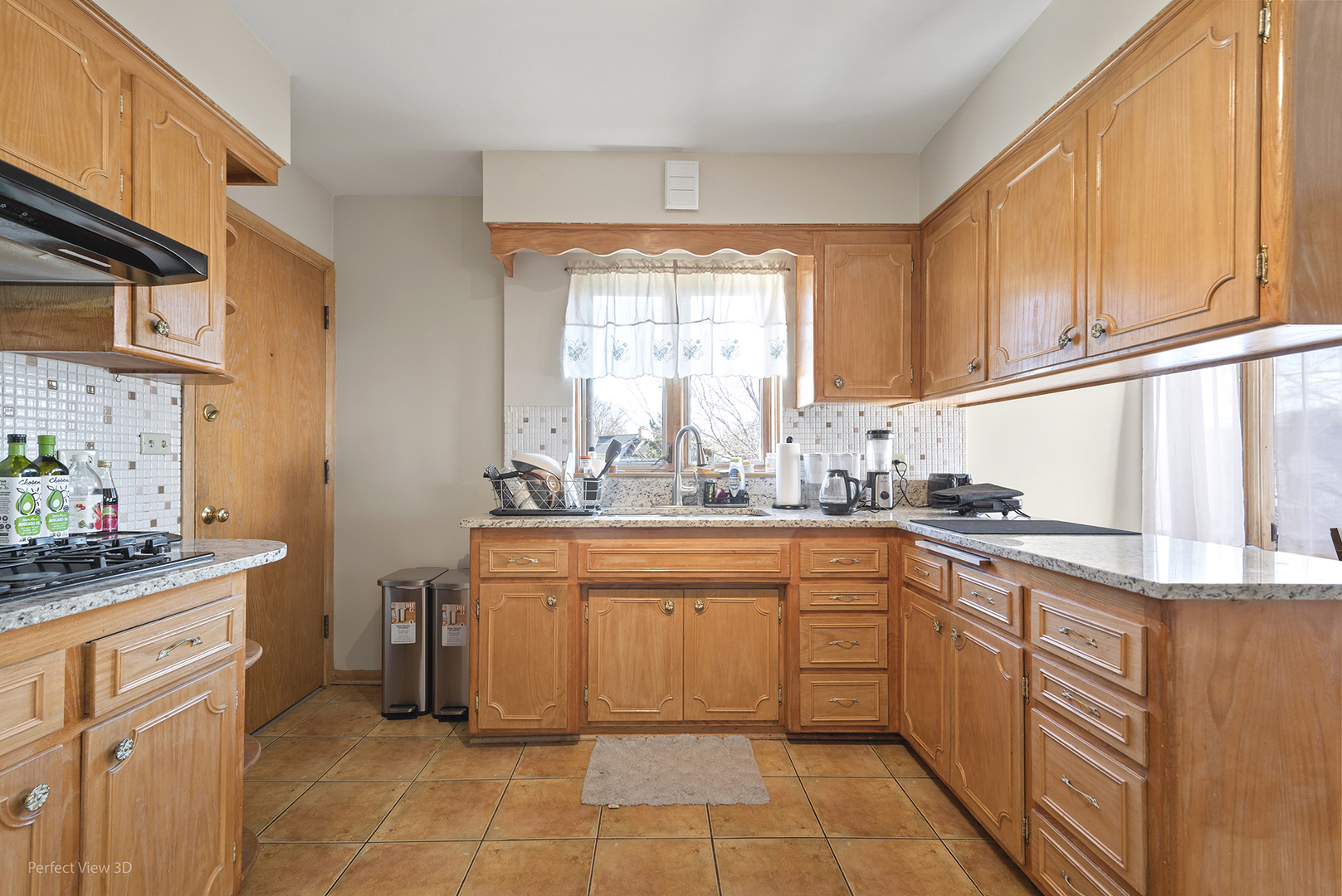 1121 North Northwest Highway Park Ridge, IL 60068 - Photo 15 of 26 a kitchen with stainless steel appliances granite countertop a sink and cabinets