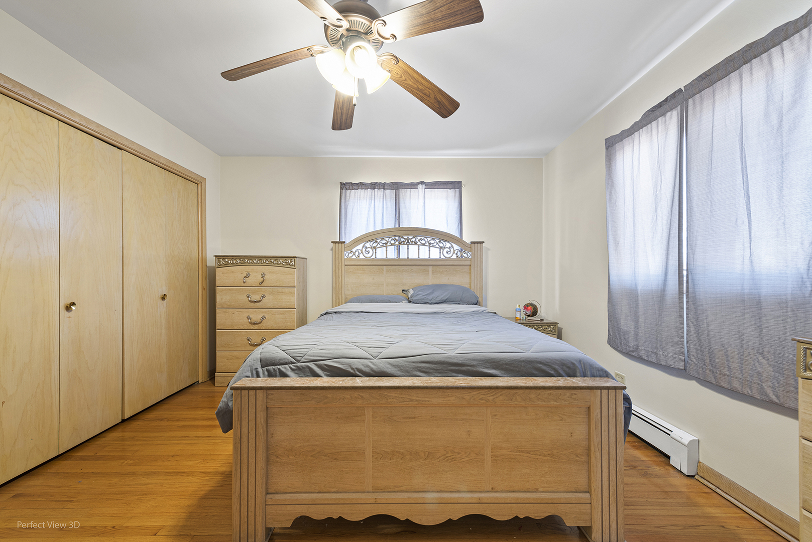 1121 North Northwest Highway Park Ridge, IL 60068 - Photo 19 of 26 a bedroom with a bed and a chandelier