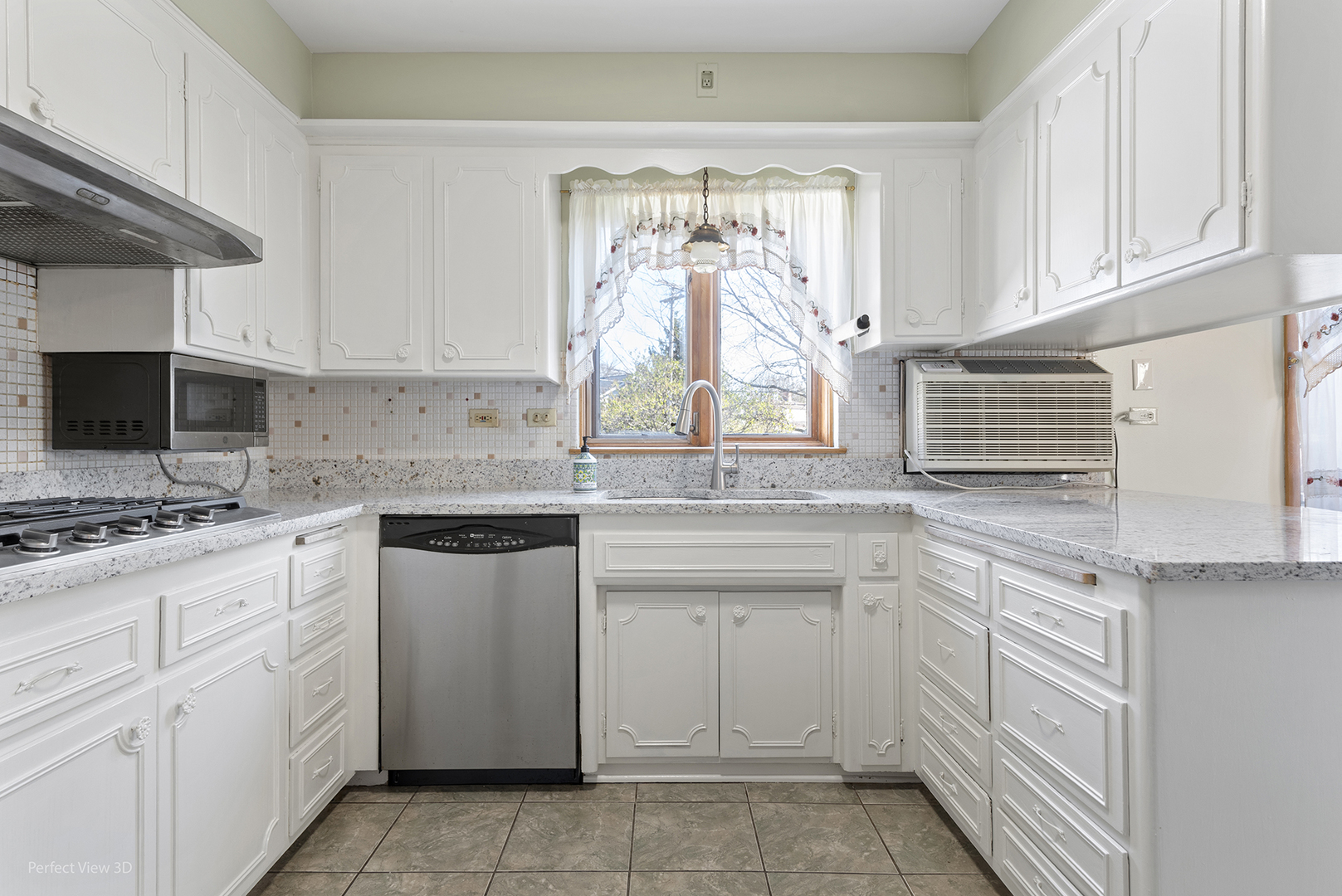 1121 North Northwest Highway Park Ridge, IL 60068 - Photo 2 of 26 a kitchen with white cabinets and white appliances
