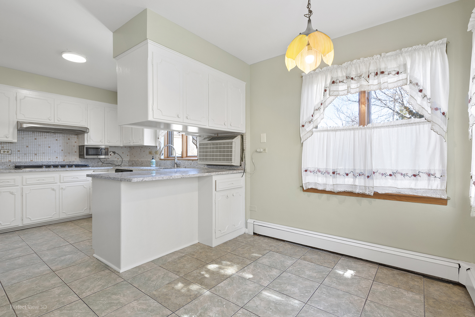 1121 North Northwest Highway Park Ridge, IL 60068 - Photo 4 of 26 a kitchen with granite countertop a white stove top oven and cabinets