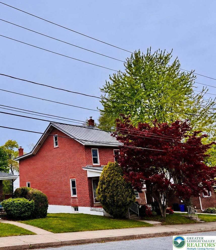 414 South 6th Street Emmaus, PA 18049 - Photo 1 of 29 This classic red brick residence features a durable metal roof and inviting facade.