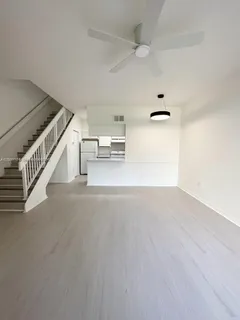 a view of a hallway with stairs