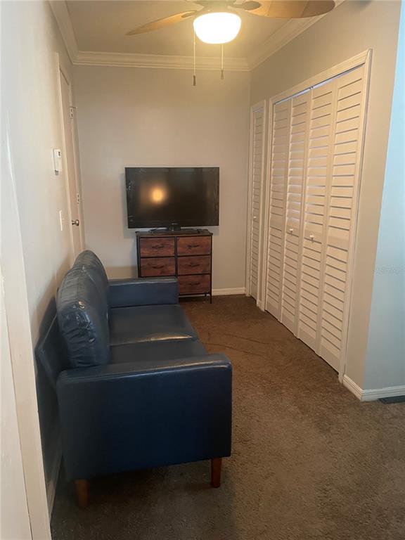 575 Tiberon Cove Road Longwood, FL 32750 - Photo 36 of 56 a living room with furniture and a flat screen tv