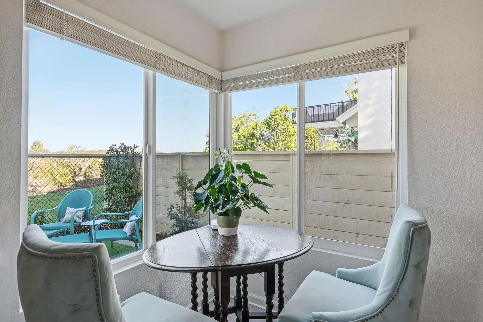 3626 Lorimer Lane Encinitas, CA 92024 - Photo 17 of 62 a view of a dining room with furniture window and wooden floor