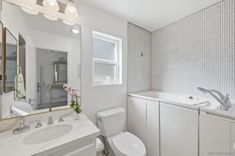 a bathroom with a sink double vanity and a mirror