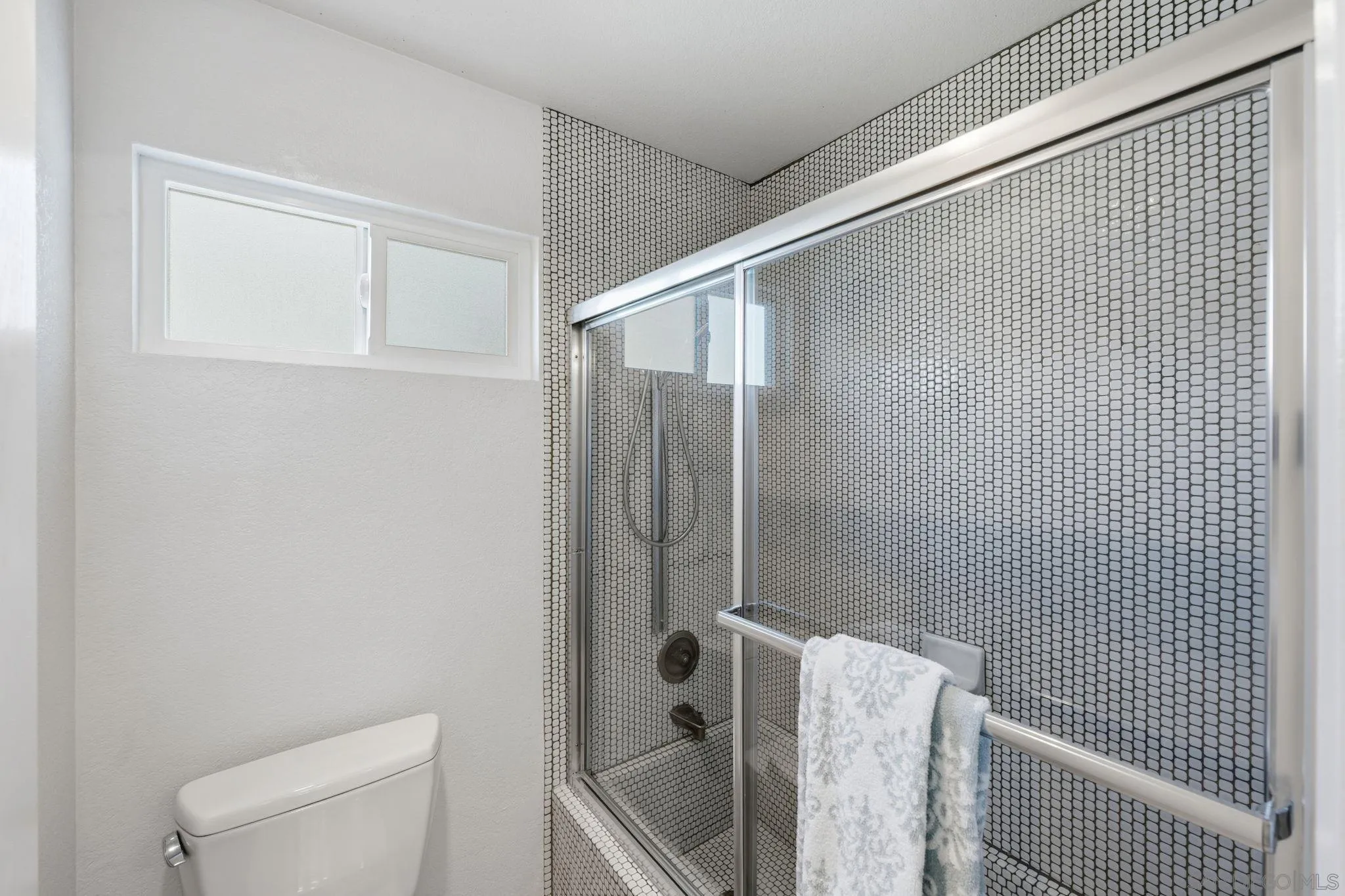 3626 Lorimer Lane Encinitas, CA 92024 - Photo 32 of 62 a bathroom with a shower and toilet