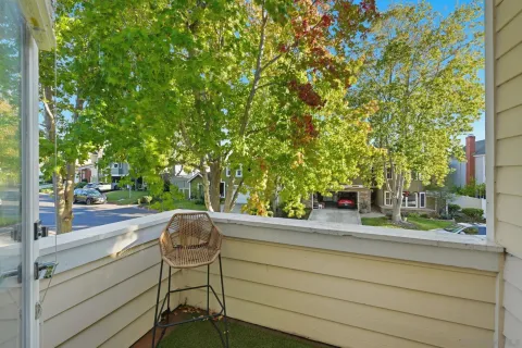 a view of a chairs and table in patio with a yard