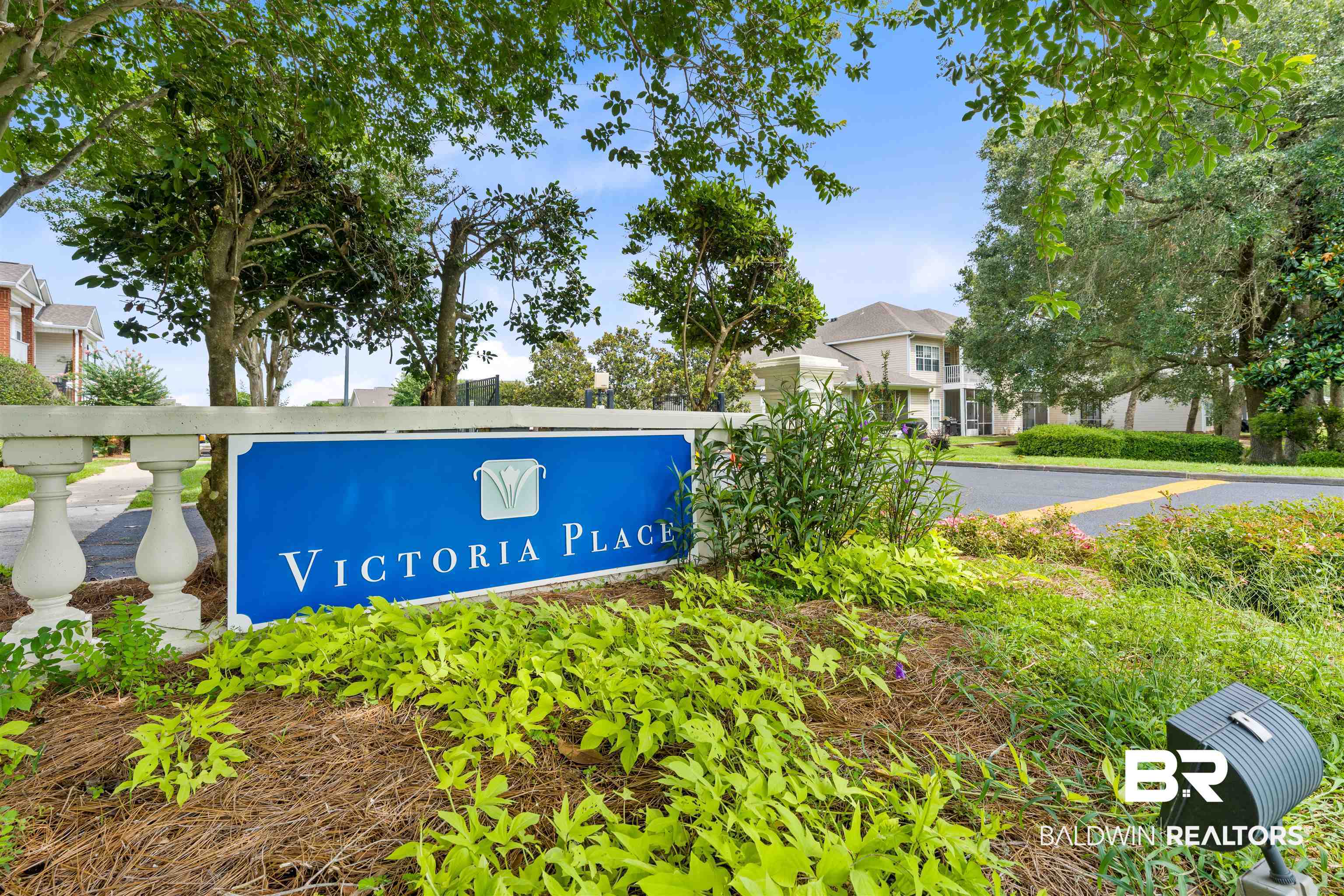 2651 South Juniper Street, Unit 1801 Foley, AL 36535 - Photo 3 of 16 "Victoria Place" community signage with white balustrade detailing