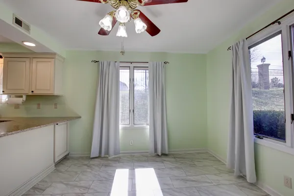 wooden floor in an empty room with a fireplace