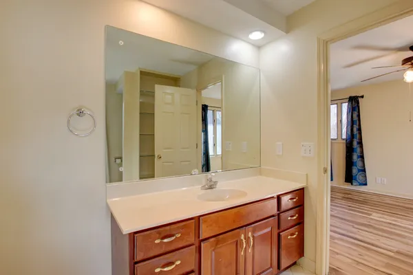 a white toilet sitting next to a shower curtain