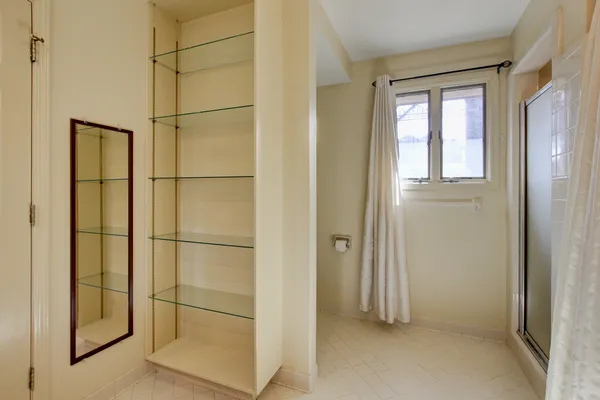 a utility room with cabinets washer and dryer