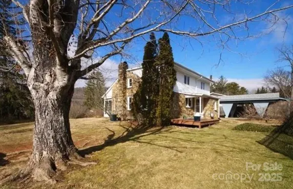 a view of a house with snow in a yard