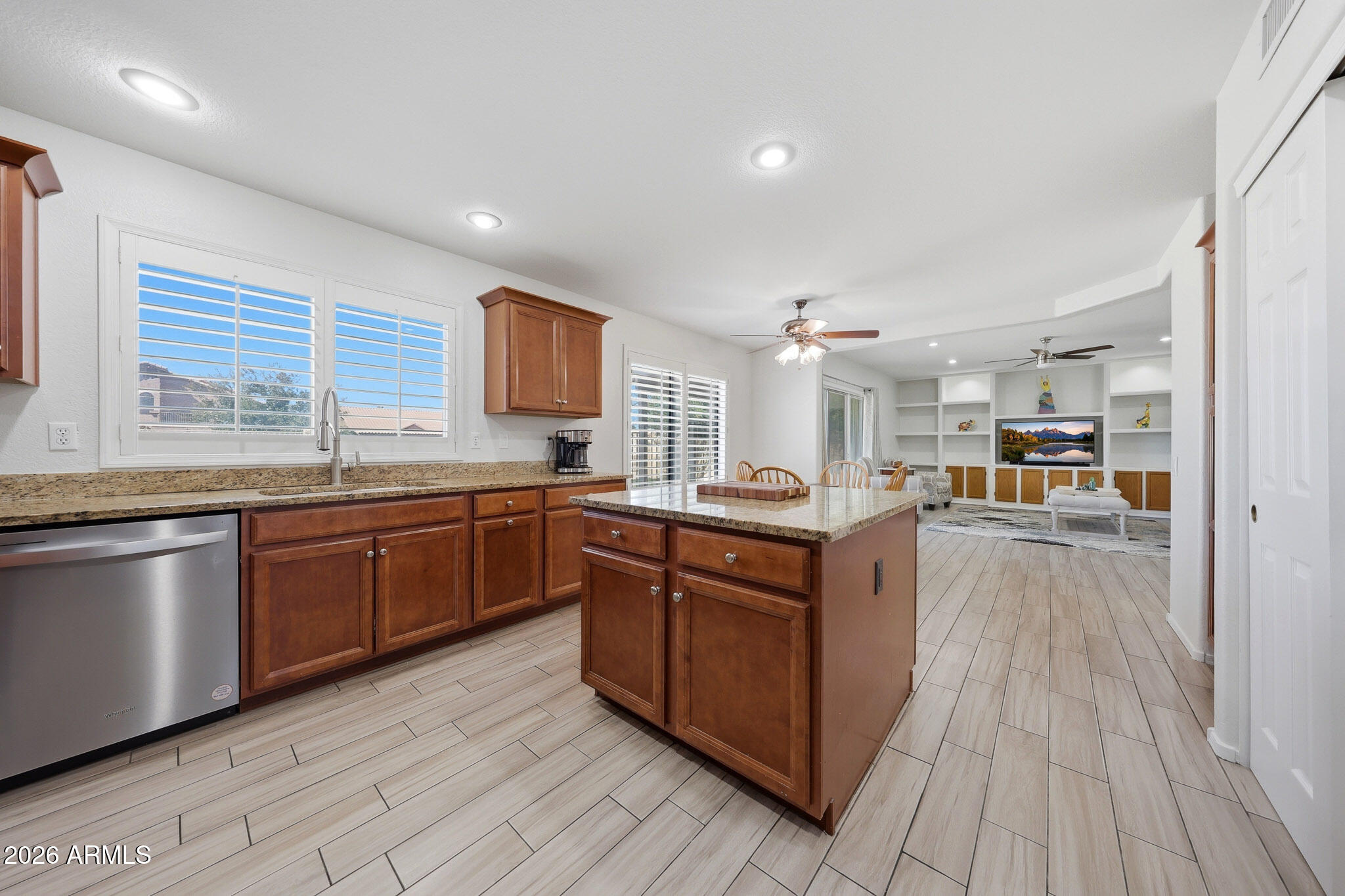 648 South Cholla Street Gilbert, AZ 85233 - Photo 10 of 46 a large kitchen with stainless steel appliances granite countertop a large stove a sink dishwasher and a refrigerator