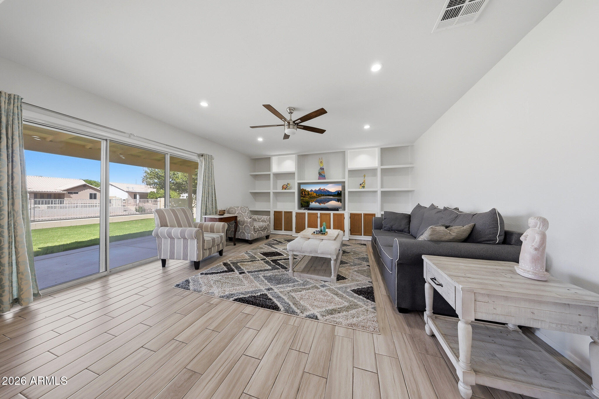 648 South Cholla Street Gilbert, AZ 85233 - Photo 13 of 46 a living room with lots of furniture wooden floor and a rug