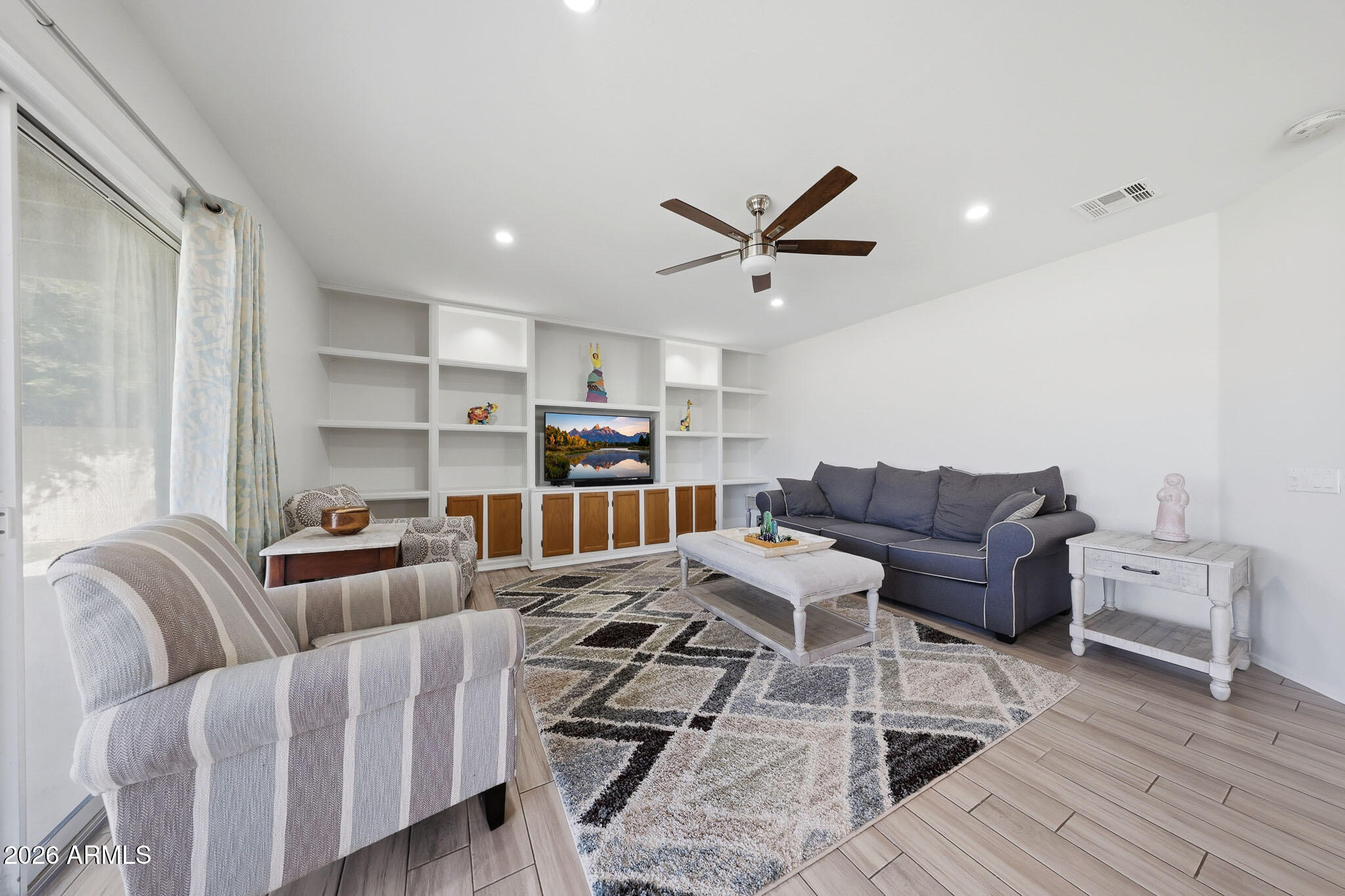 648 South Cholla Street Gilbert, AZ 85233 - Photo 14 of 46 a living room with furniture and a wooden floor