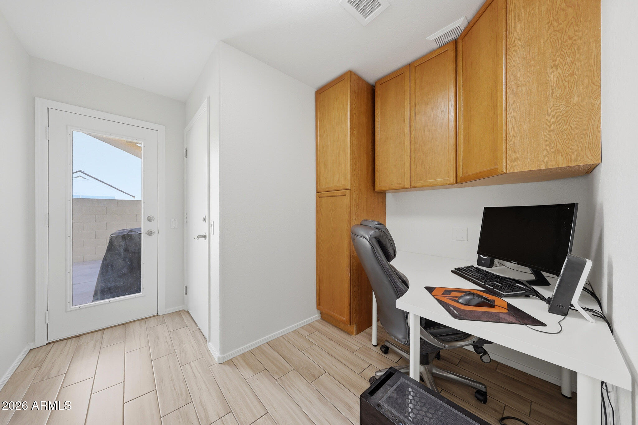 648 South Cholla Street Gilbert, AZ 85233 - Photo 16 of 46 a view of workspace with wooden floor and windows