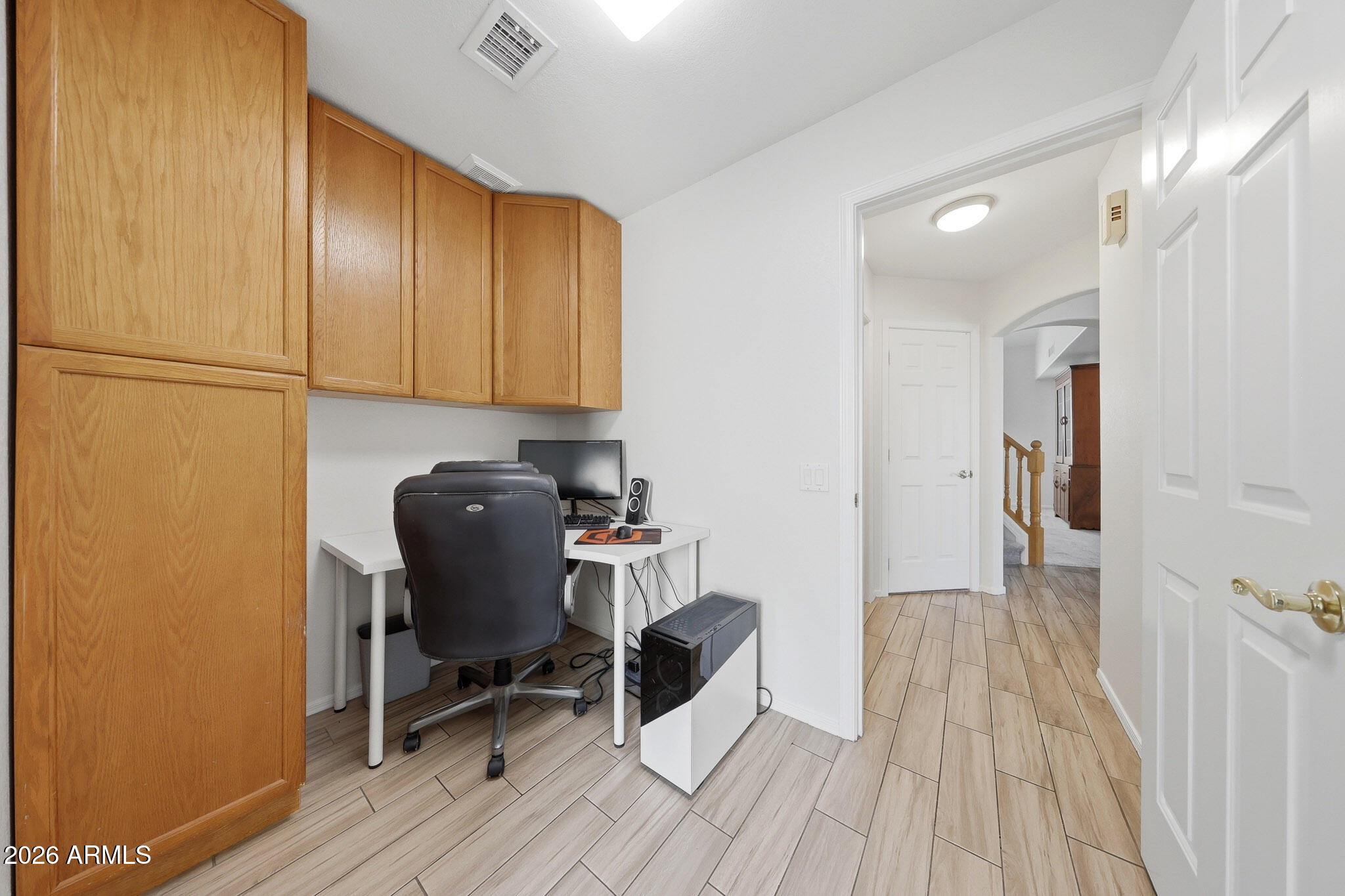 648 South Cholla Street Gilbert, AZ 85233 - Photo 17 of 46 a view of a workspace with furniture and wooden floor
