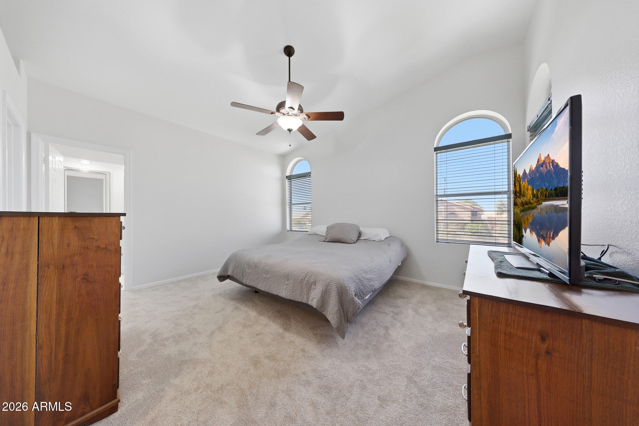648 South Cholla Street Gilbert, AZ 85233 - Photo 19 of 46 a bedroom with a bed and a flat screen tv