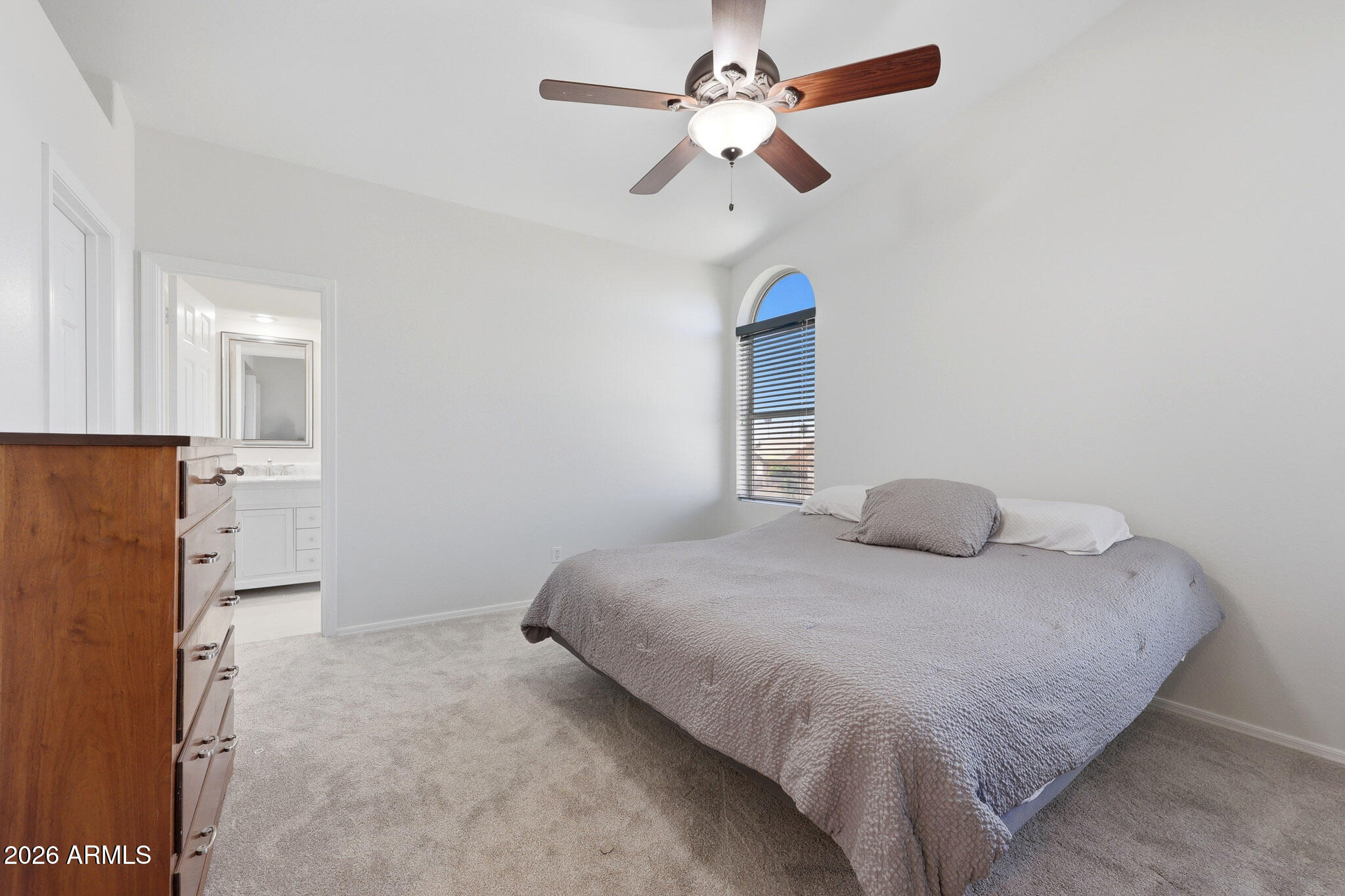 648 South Cholla Street Gilbert, AZ 85233 - Photo 20 of 46 a bedroom with a bed and a ceiling fan